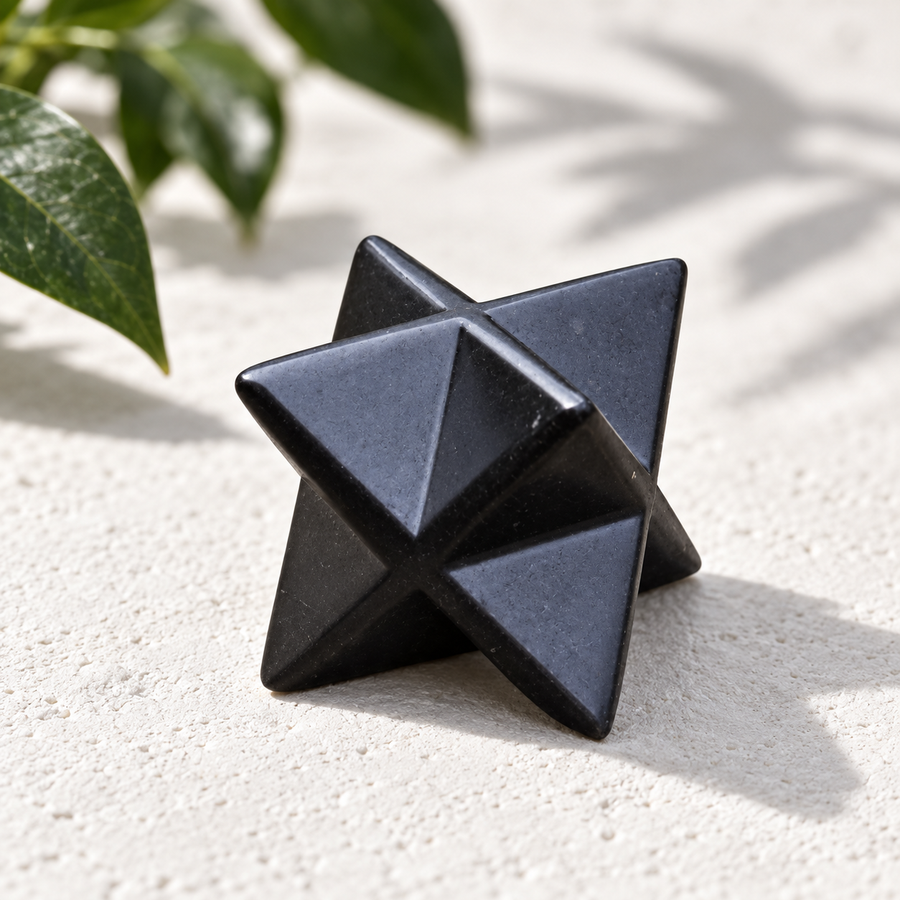 Polished shungite merkaba, studio shot with shadow