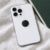 Shungite phone sticker in use on the back of a phone