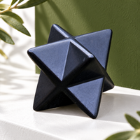 Polished shungite merkaba on a shelf