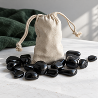 Polished tumbled shungite stones in a drawstring bag