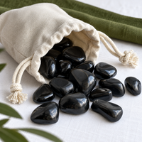 Open cotton bag of polished tumbled shungite stones, 670 g