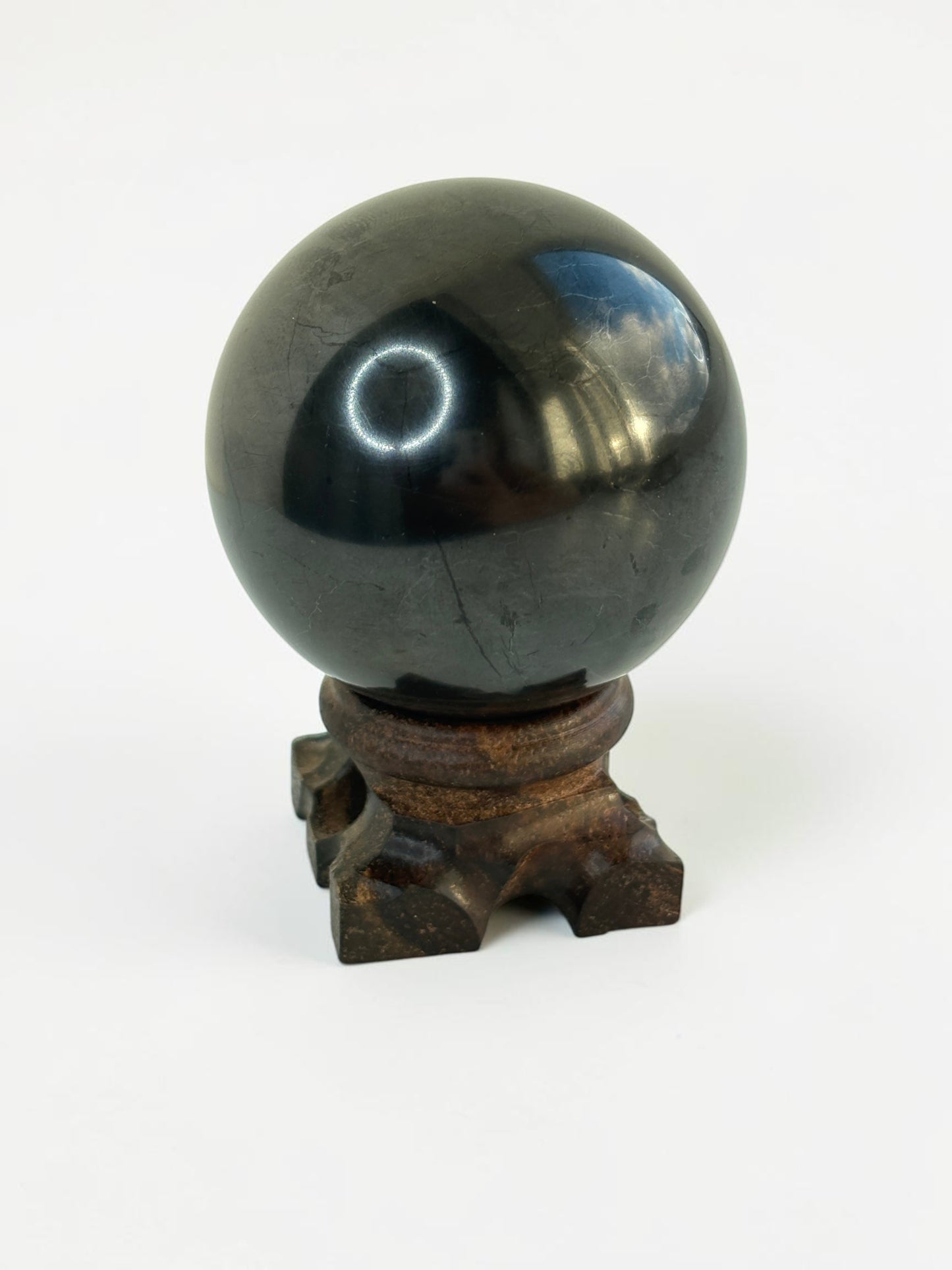 Shungite Sphere on Wooden Stand